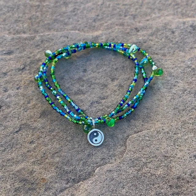 Stretch necklace or triple wrap bracelet with sterling yin yang charm