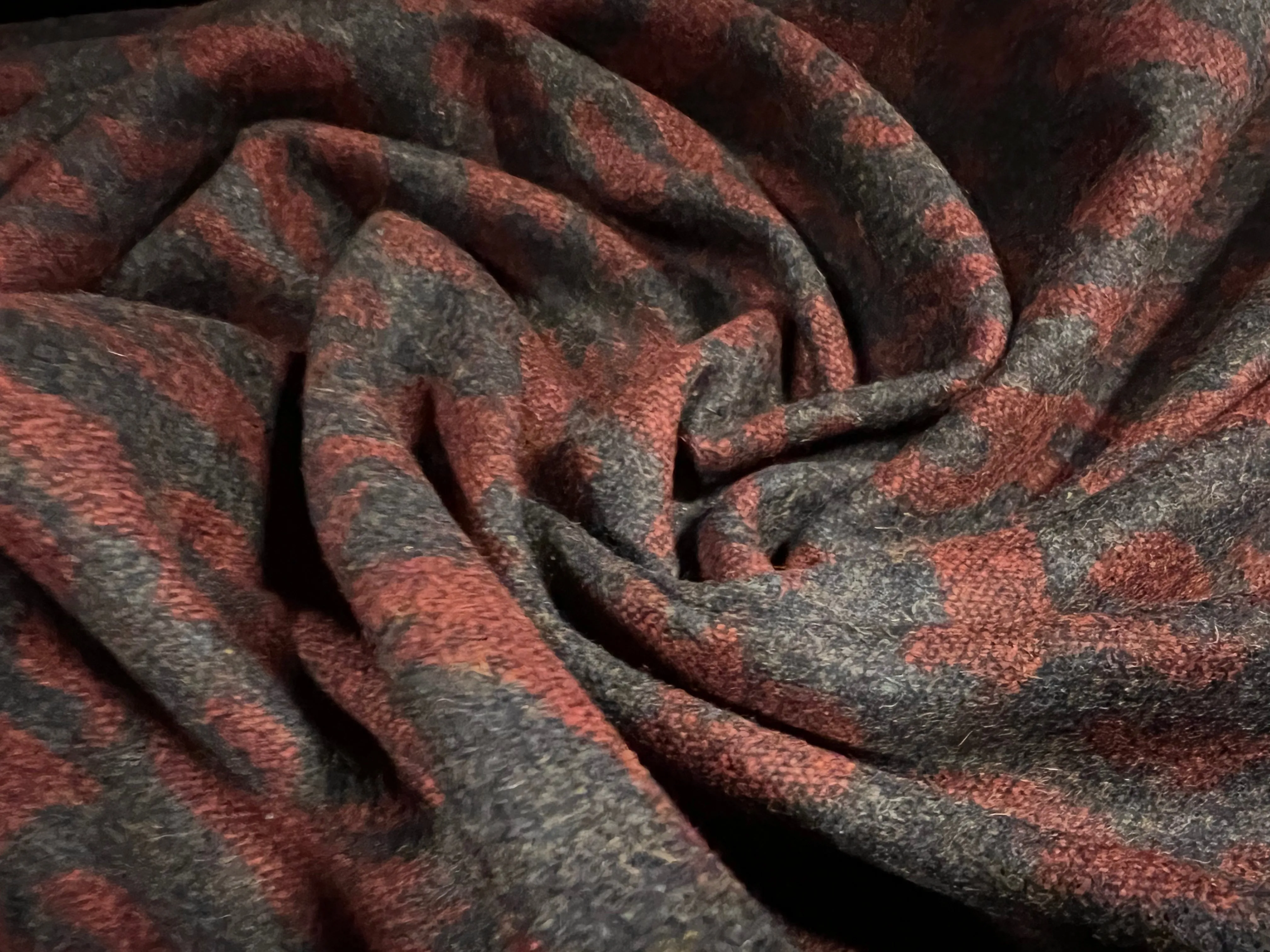 Wool jacquard woven fabric, per metre - abstract swirl - charcoal grey & dark red